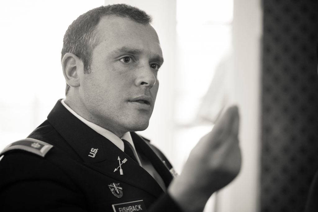 Photo: Major Ian Fishback in conversation at a dinner hosted by CERL as part of its conference, “The Weighing of Lives in War: Combatants and Civilians in the Jus in Bello” (2014)